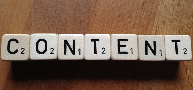 Photo with scrabble pieces spelling out the word Content