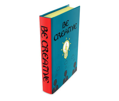 A book that is standing on its end and the front cover is blue with a yellow bulb in the middle and above it reads be creative