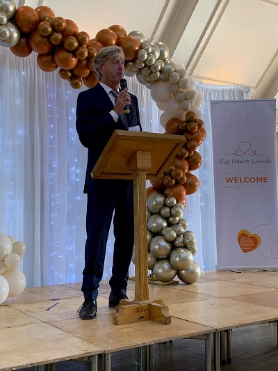 Saint Francis event, Big Heart Lunch_Richard Madeley, guest speaker on stage, talking to diners.