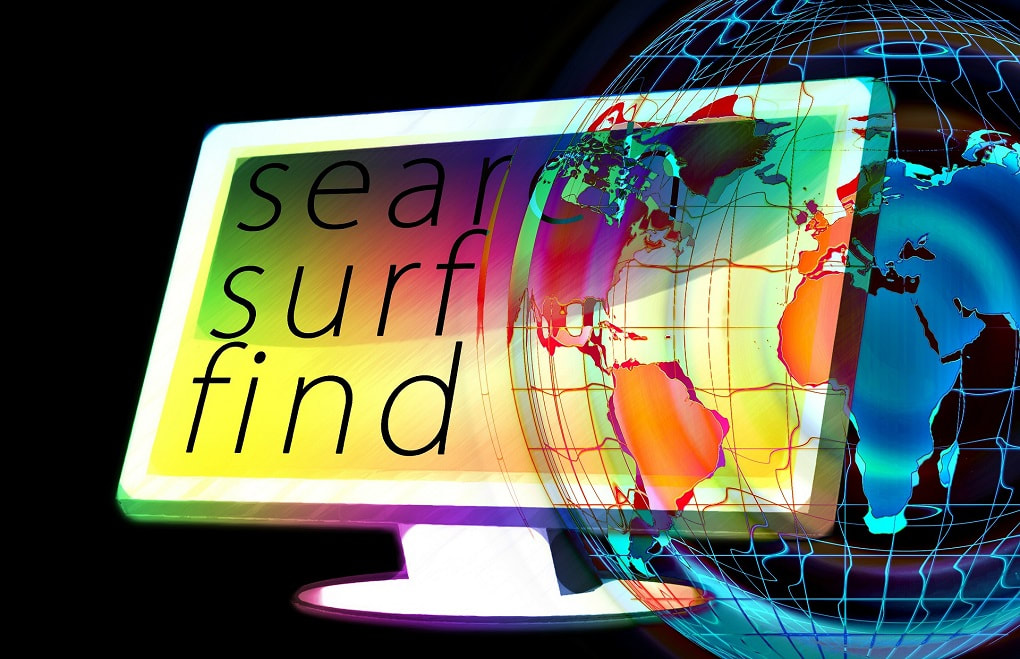 colourful computer screen with the words search surf and find on the monitor