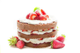 Victoria sponge cake with whipped cream and strawberries