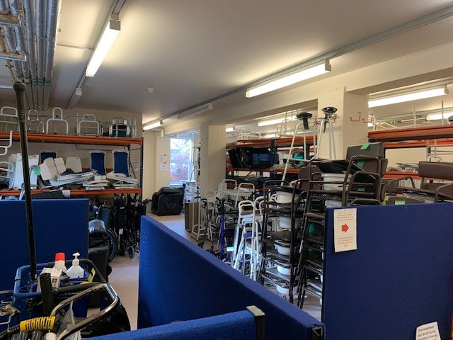 Storage room full of donated reusable equipment for patients of Saint Francis Hospice_equipment includes wheelchairs, zimmer frames, crutches and shower chairs