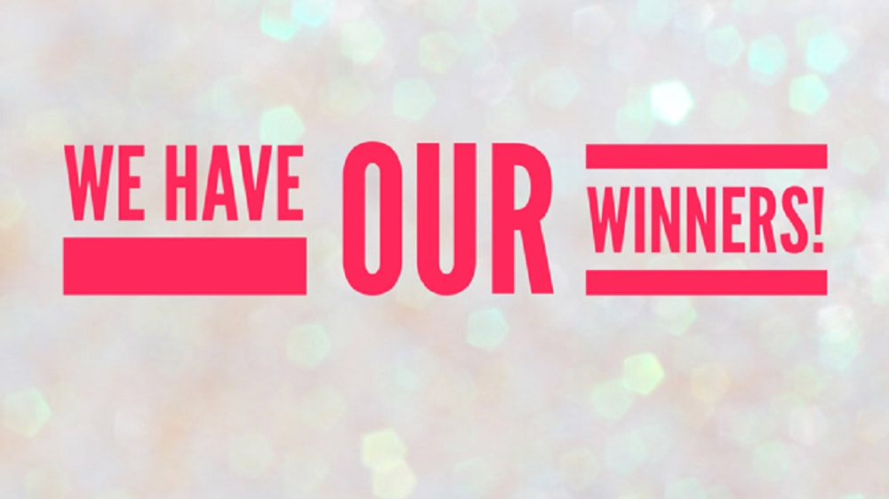 image on a sparkly light pink background that reads, we have our winners